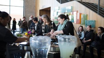 Attendees serving themselves food