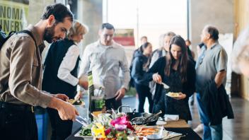 Attendees serving themselves food