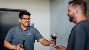 Wine being poured at he reception. 