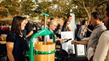DEVO students pouring Oakville Station wine