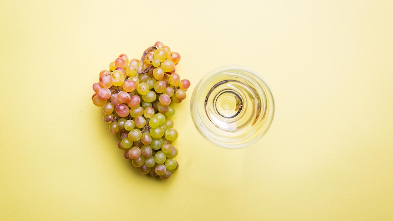 Grapes and glass on table