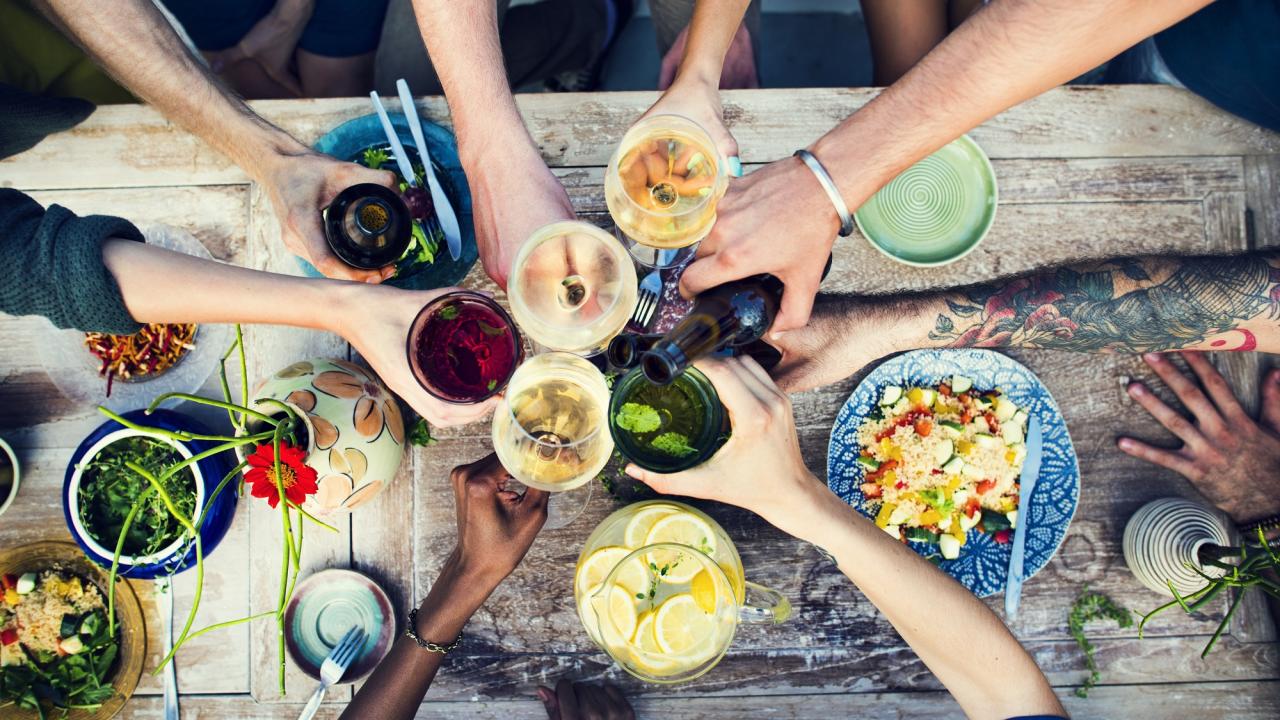 Toasting over a dinner table