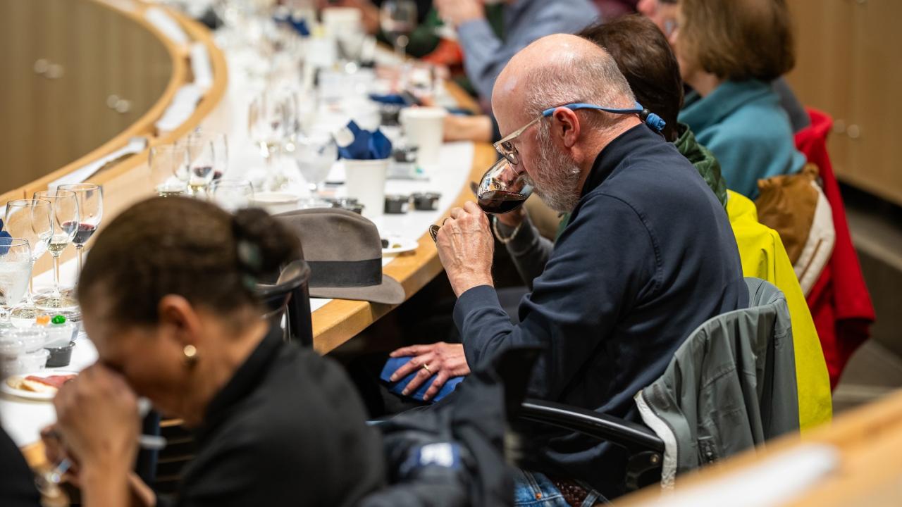 Attendees smelling aroma of wine in the Sensory Theater