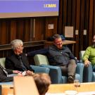 Panel discussion with Bill Ristenpart, Jerry Baldwin, Russ Kramer and Peter Giuliano speakers seated on chairs, engaged in conversation.