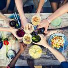 Toasting over a dinner table