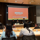 Students presenting in front of guests