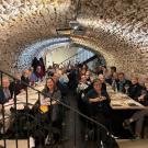 CAAA French wine trip attendees at dinner in a cave 2024